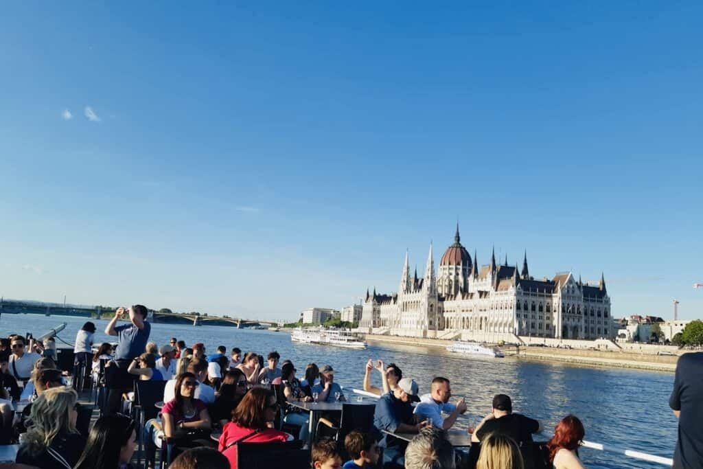 People sitting on a boat in Budapest, Hungary.