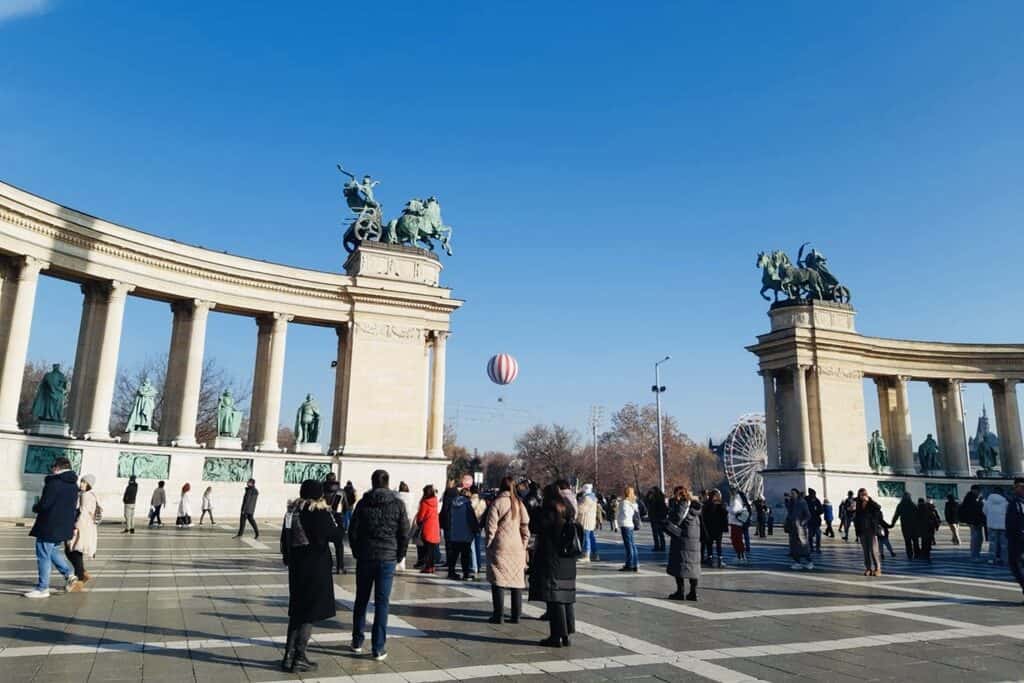 People standing at the Heroes' Square in Budapest, Hungary.