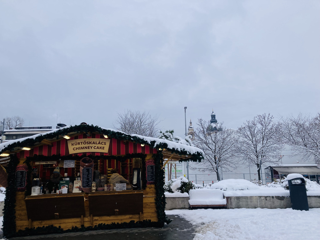 A shop for chimney cake at a small Christmas market at Deák Square, Budapest.