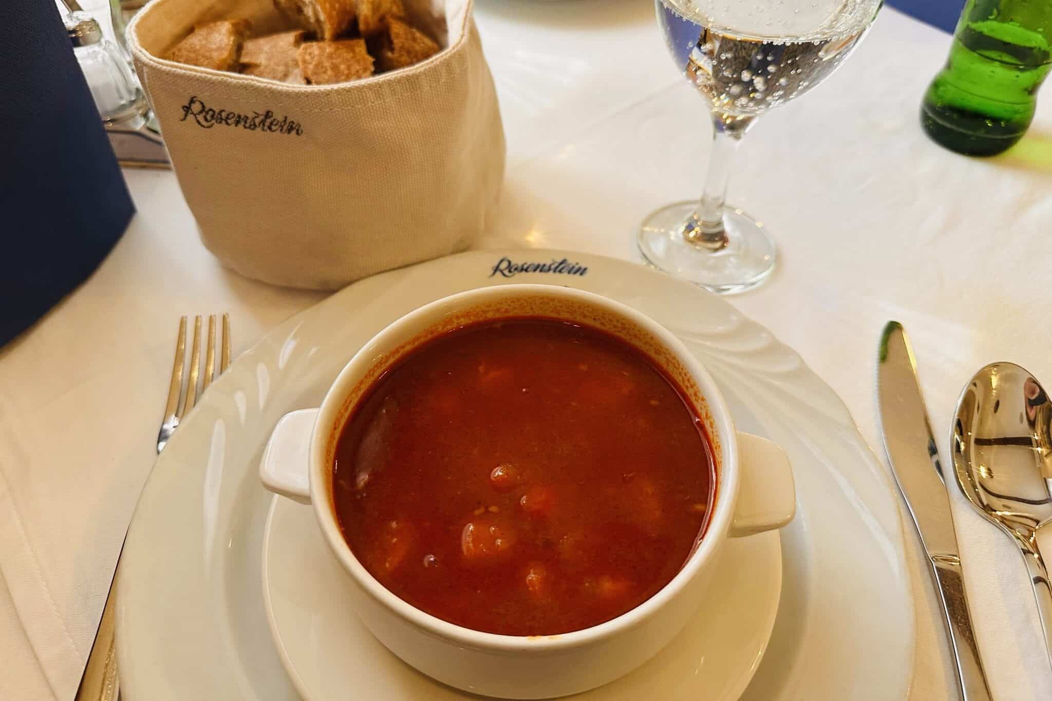 Goulash soup in a bowl on a table.