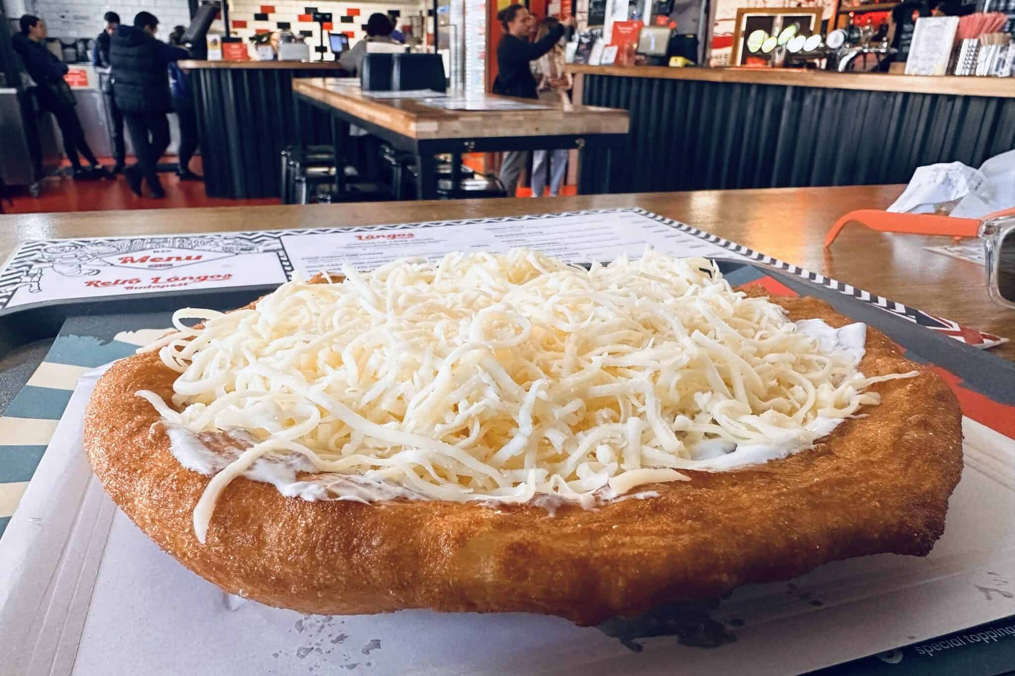 Lángos, a traditional Hungarian salty, deep-fried snack.