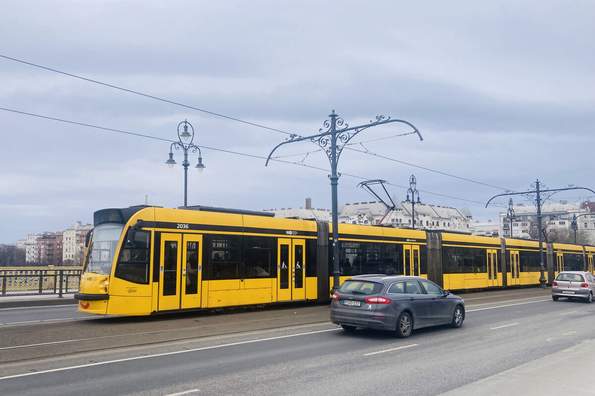 Yellow tram on Margaret Bridge in Budapest, Hungary.