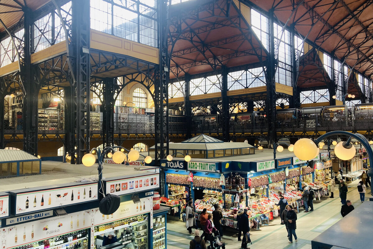 People shopping by the stalls at the Central Market Hall in Budapest, Hungary.