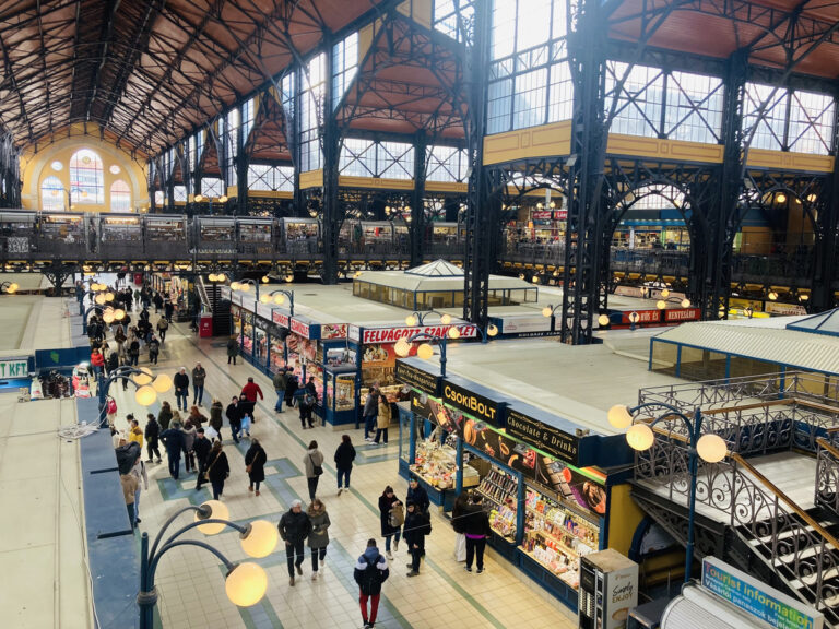 People shopping by the stalls at the Central Market Hall in Budapest, Hungary.
